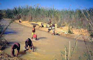 Shifting sapphires in river, Ilakaka area, miners, sapphire rush in Madagascar